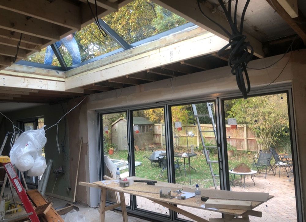 Bifold patio doors installation in progress at residential property interior