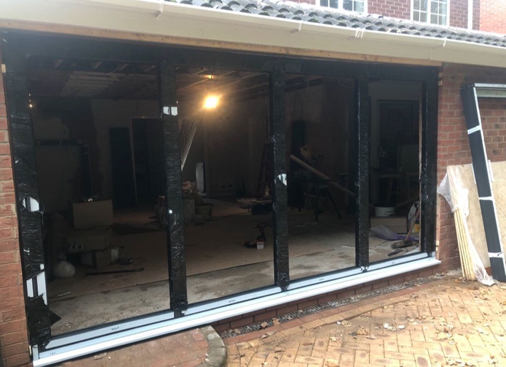 Bifold patio doors installation in progress at residential property